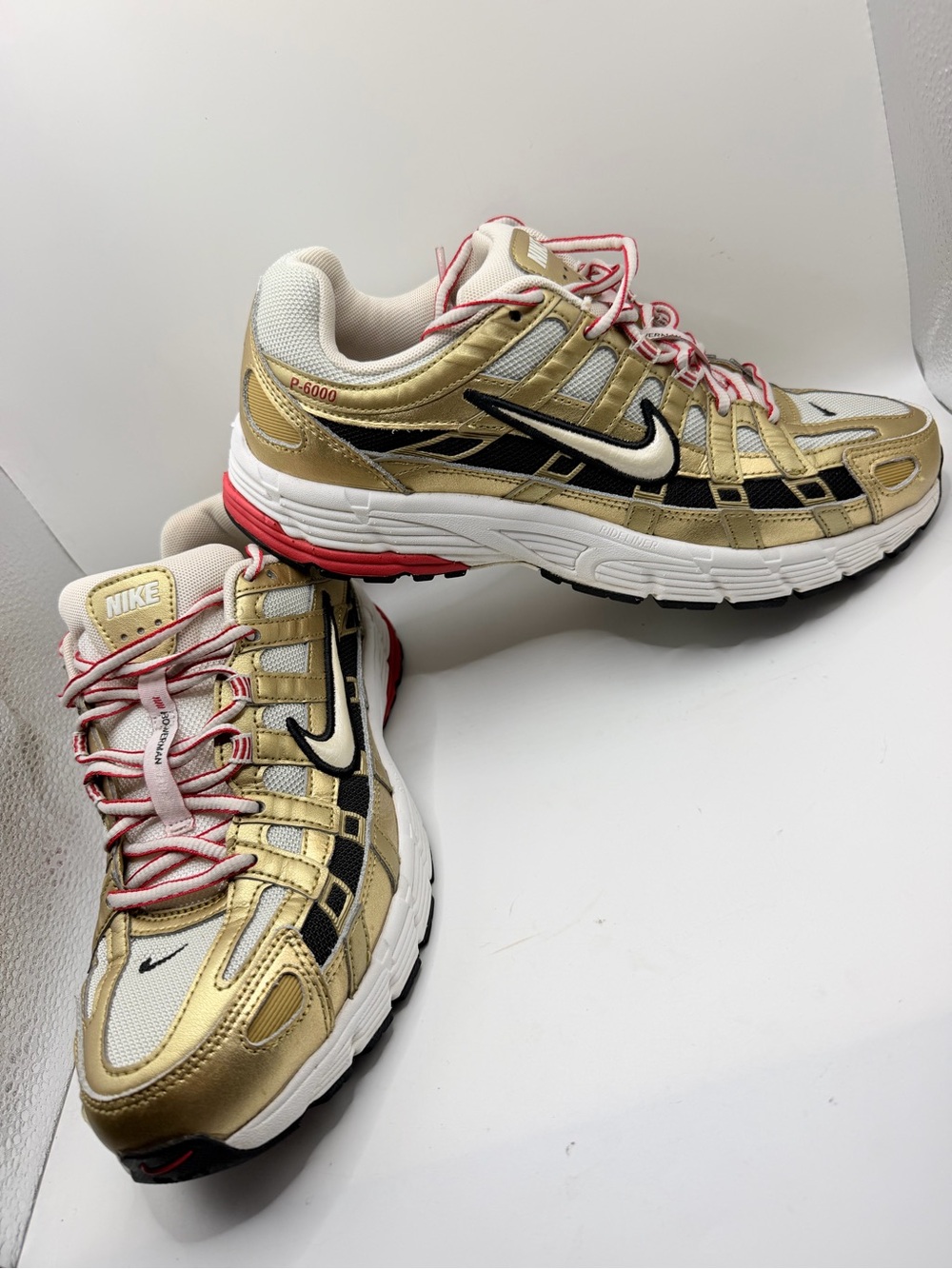 Nike Women’s Gold & Black Athletic Sneakers with Pink Accents